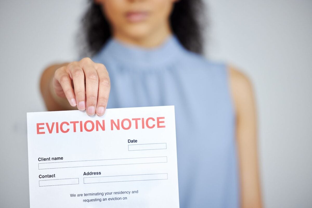Woman holding an eviction notice