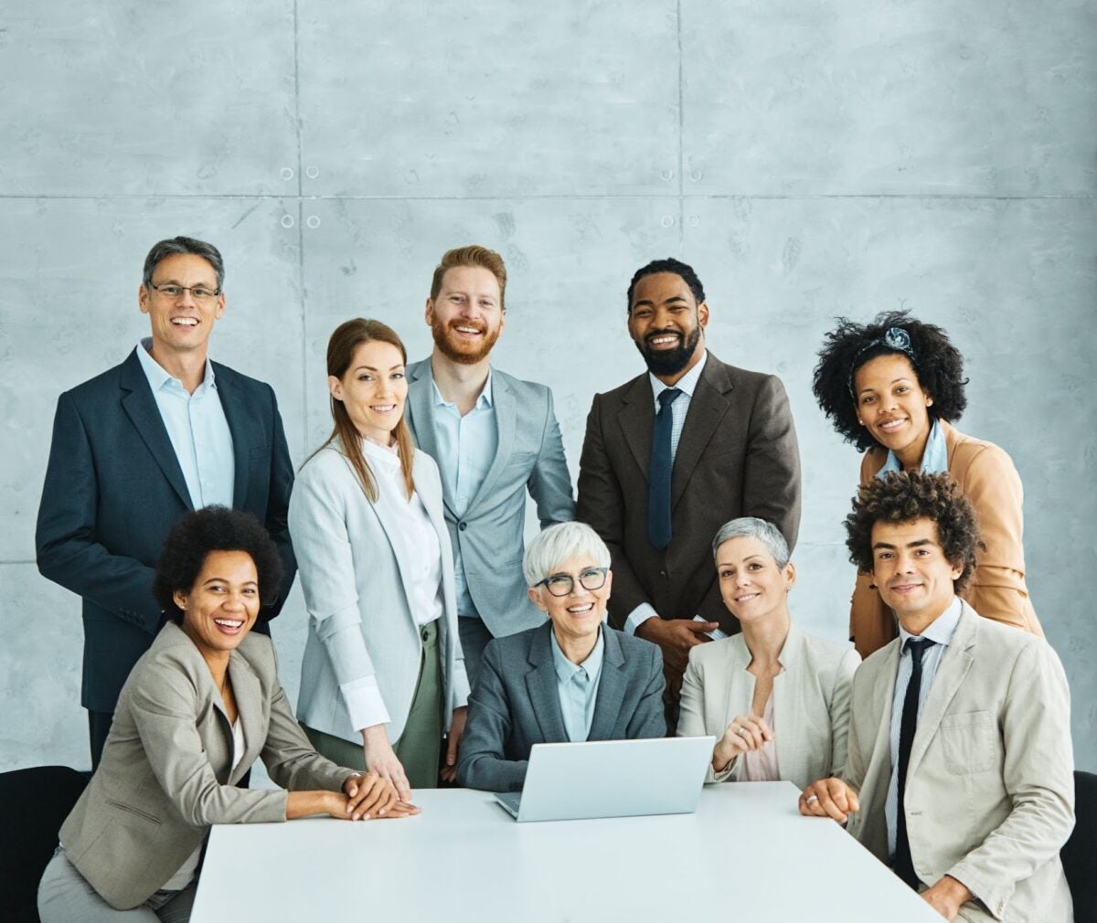 A team of professionals meeting around a table.